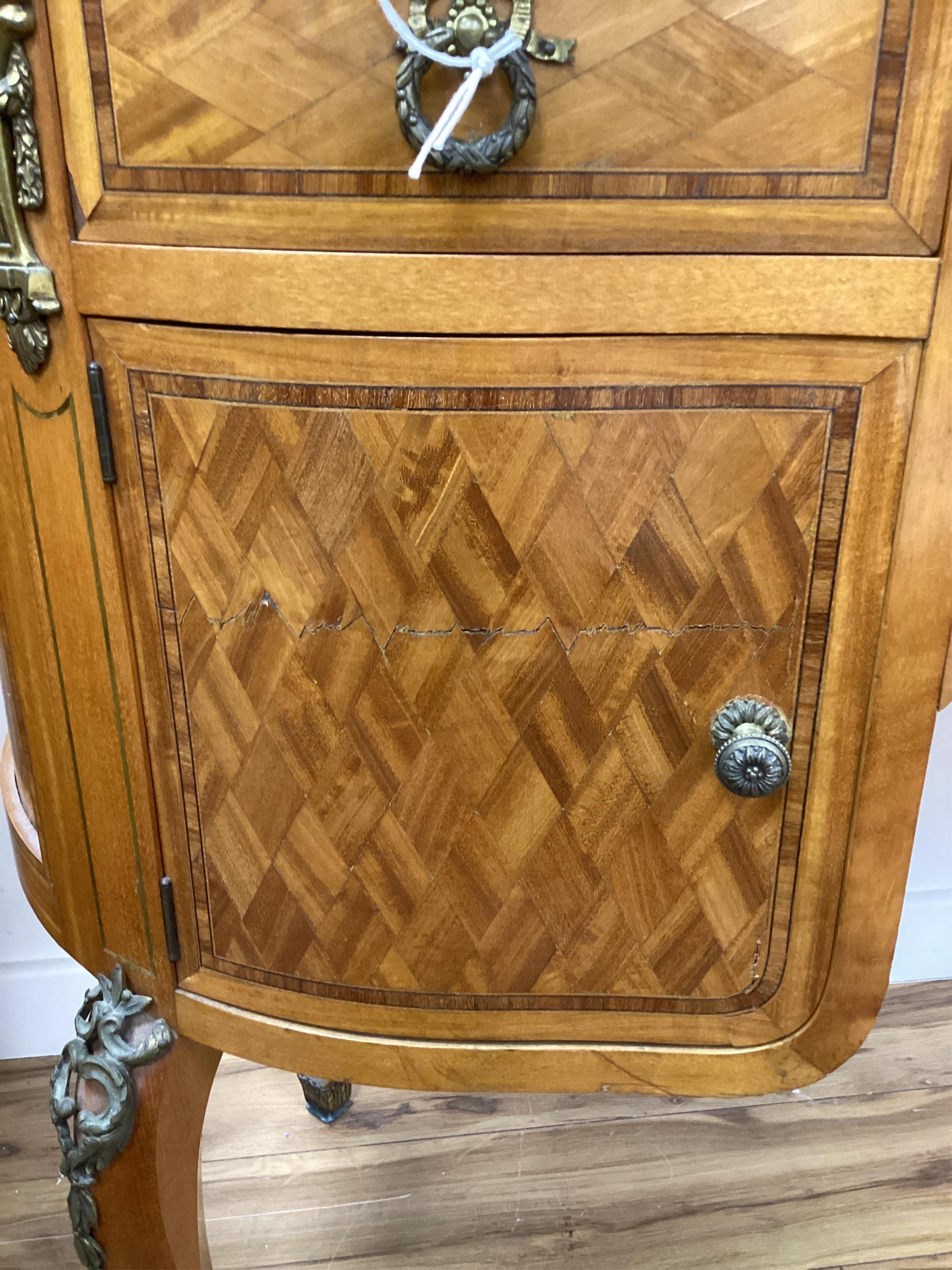 An early 20th century French transitional style gilt metal mounted tulip banded and parquetry inlaid kneehole dressing table, width 115cm, depth 50cm, height 160cm